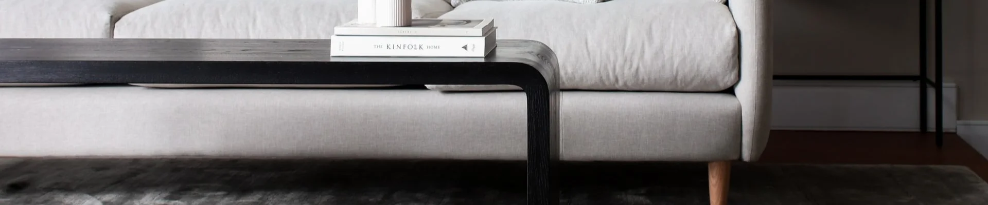 Grey sofa and area rug in a modern home